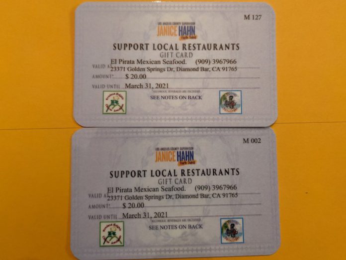 "餐廳餐卡計畫" 原文是 "Restaurant Voucher Program"。